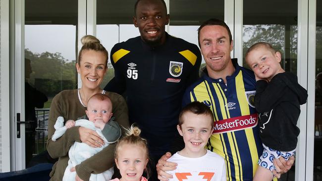 James Maloney couldn’t resist a family snap with Usain Bolt. (Brett Costello)