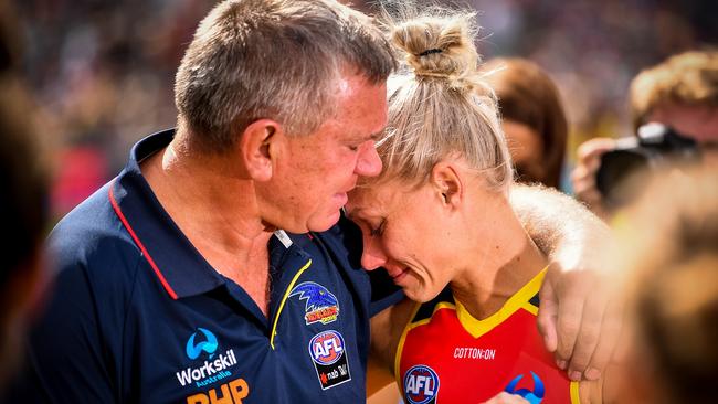 Erin being comforted by her dad, former AFL footballer Greg Phillips. Picture: Getty