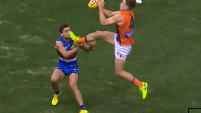 Screen grab of GWS Toby Greene kicking Western Bulldogs Luke Dahlhaus in the face.