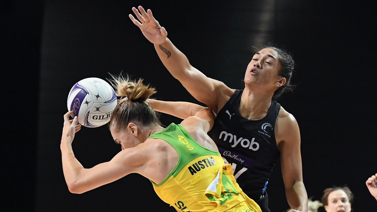 Kiera Austin is crunched by Sulu Fitzpatrick at Christchurch Arena. Picture: Kai Schwoerer/Getty