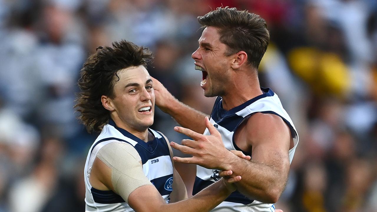 MELBOURNE, AUSTRALIA - APRIL 05: Jordan Clark of the Cats is congratulated by Tom Hawkins after kicking a goal during the round 3 AFL match between the Geelong Cats and the Hawthorn Hawks at Melbourne Cricket Ground on April 05, 2021 in Melbourne, Australia. (Photo by Quinn Rooney/Getty Images)