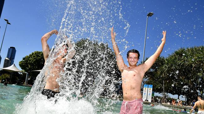 Luca Reddi from the UK and Stephan Enckhof from the Netherlands in South Bank have fun in the sun at Brisbane Lagoon, South Bank. Picture: NewsWire / John Gass