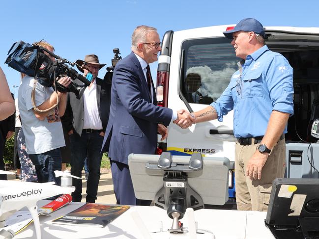 Labor leader Anthony Albanese visits Disaster Relief Australia veterans in Kallangur, Brisbane, and meets Dean West, senior remote pilot for Disaster Relief Australia. Picture: Toby Zerna.