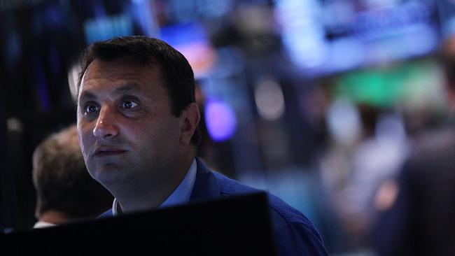 NEW YORK CITY, NY - AUGUST 06: A trader works on the floor of the New York Stock Exchange (NYSE) on August 06, 2015 in New York City. The Dow Jones industrial average fell 120 points today as Wall Street braces for Friday's employment report which will give a more solid indication of the timing of a rate hike by the Federal Reserve. Spencer platt/Getty Images/AFP == FOR NEWSPAPERS, INTERNET, TELCOS & TELEVISION USE ONLY ==
