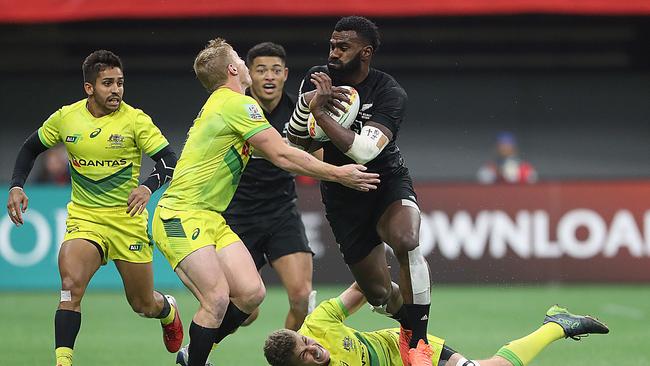 Maurice Longbottom #11, Lachie Miller #5 and Nick Malouf #10 in action for the Australian sevens team against New Zealand.