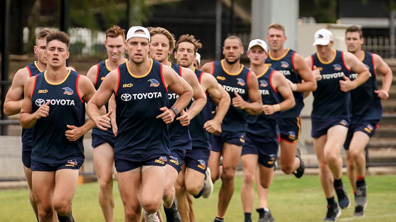 Brodie Smith leads the Crows during a pre-season running session.