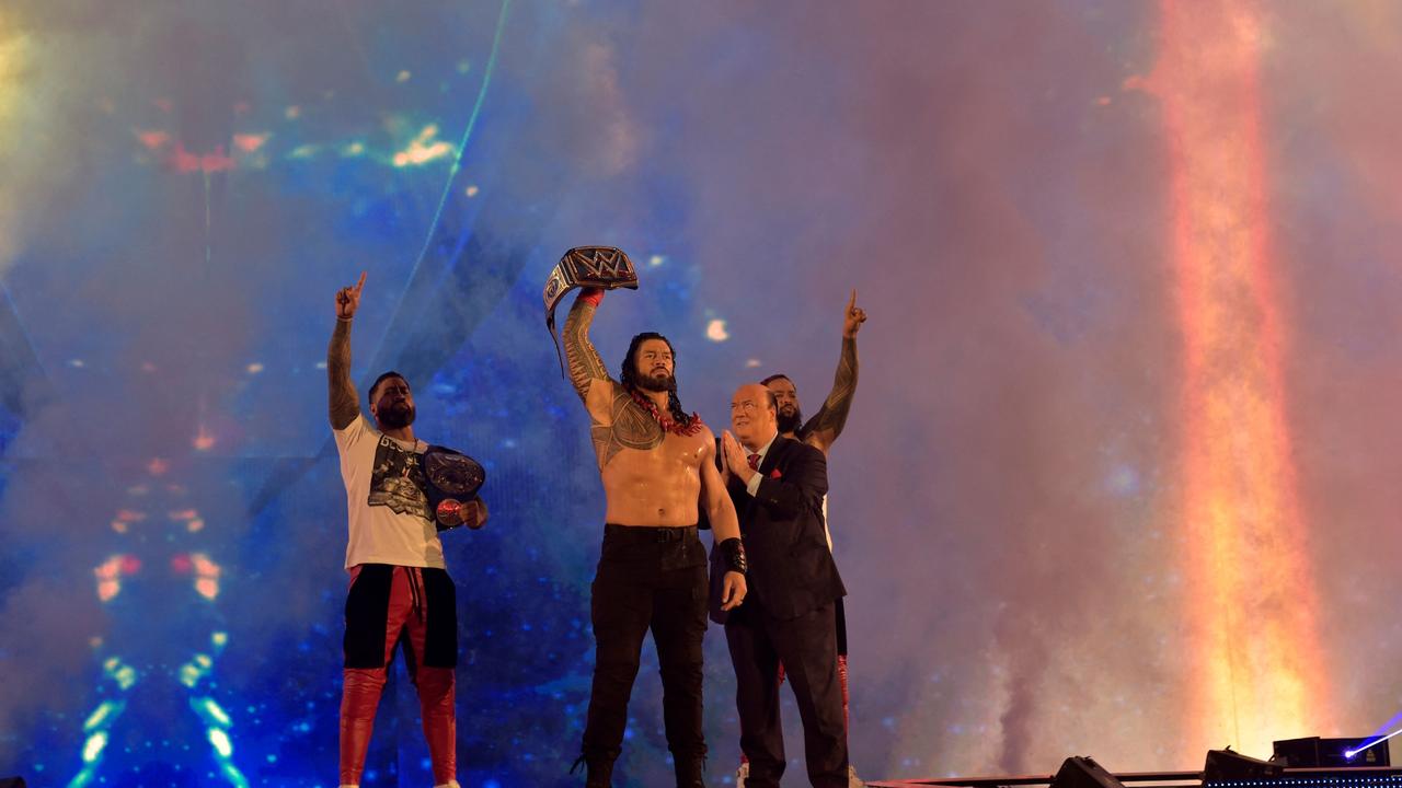 Roman Reigns wins a match during the 2022 WWE Elimination Chamber in Saudi Arabia. Photo by Amer HILABI / AFP.