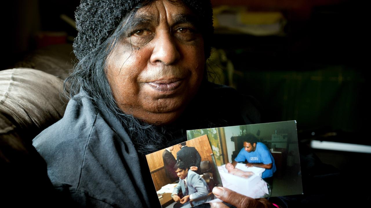 Beverly Whyman, a Stolen Generation mother, with photos of her two boys, Russell and Kelvin, who were removed from her care.