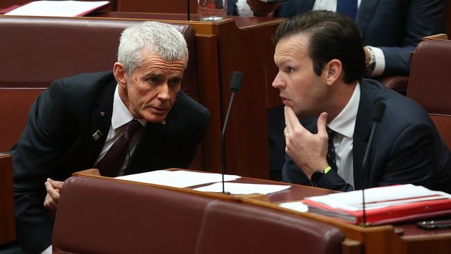 One Nation Senator Malcolm Roberts and Senator Matt Canavan in the Senate Chamber at Parliament House in Canberra. Picture Kym Smith.