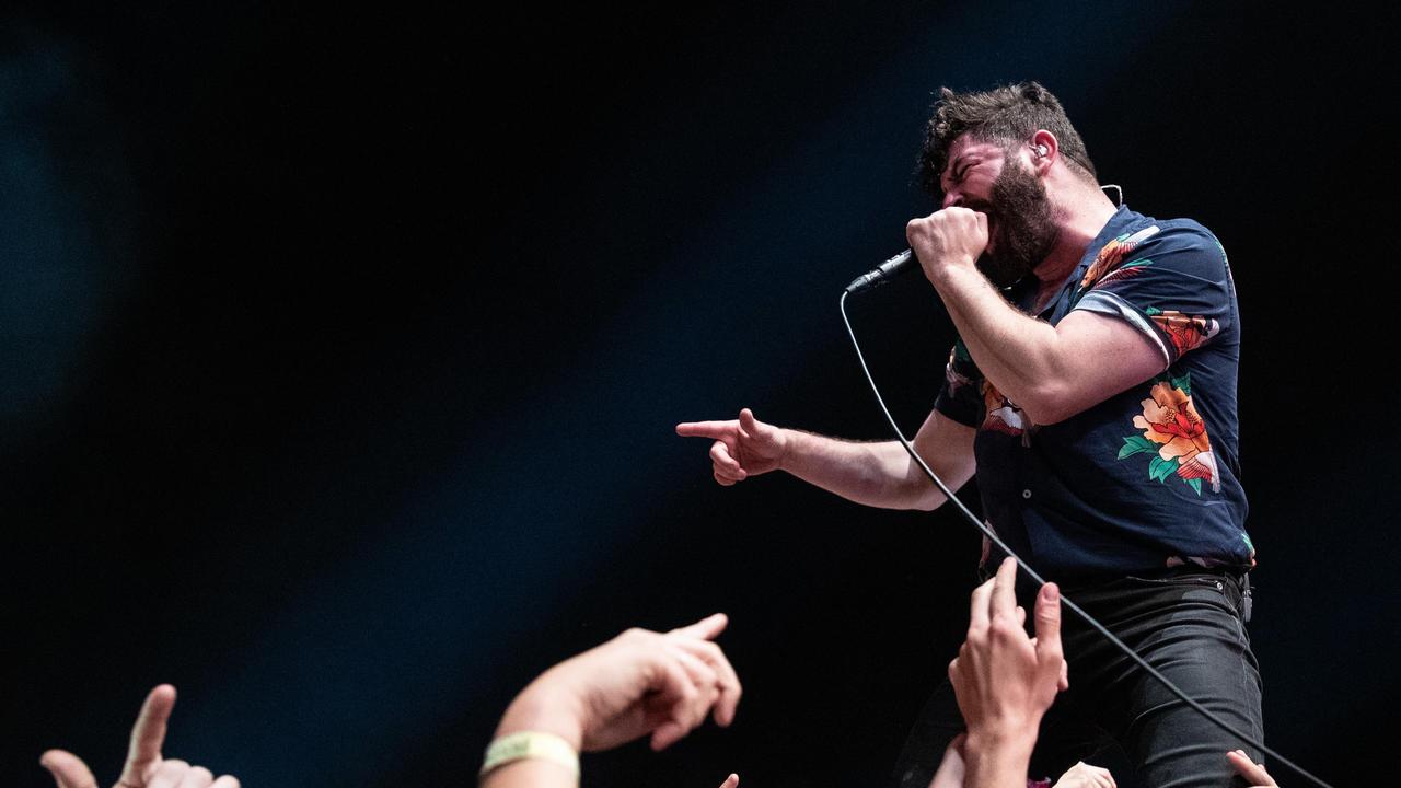 Yannis Philippakis of Foals performs in the crowd on the Amphitheatre stage. (Photo by Mark Metcalfe/Getty Images)