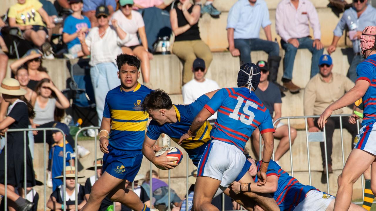 Trace Beattie offloads for TGS. 2024 O'Callaghan Cup at Downlands College. Photo by Nev Madsen