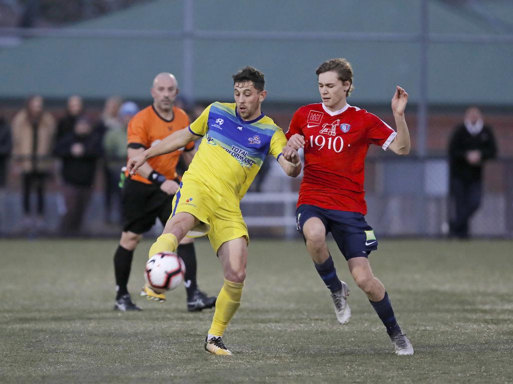 Lokoseljac Cup Final at KGV. Devonport Strikers versus South Hobart. Devonport's Joel Stone, left, and South Hobart's Bradley Lakoseljac clash. Picture: PATRICK GEE