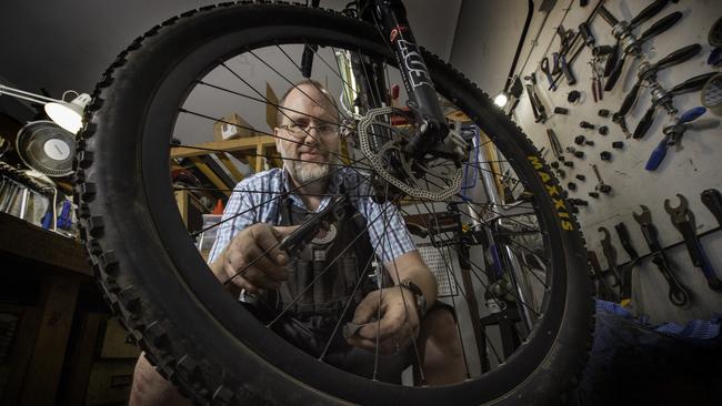 Steve Connor working on a bike at his shop, the Myrtleford Cycle Centre. Picture: Tony Gough