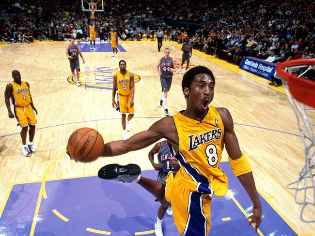 Kobe Bryant #8 of the Los Angeles Lakers goes in for a slam dunk against the New Jersey Nets during the NBA game at the Staples Center in Los Angeles in 2002. Picture: AP