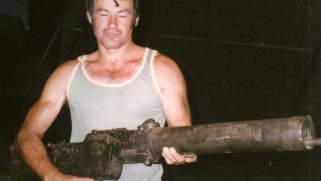 Milat in 1983 with WWI vintage machine gun at home of older brother Alex at Buxton in Southern Highlands where Alex built his own rifle range.