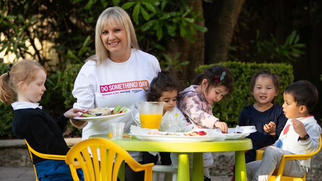 DoSomething Day 2018.Pictures taken on 25th July 2018 of News Local Editor Louise Roberts serving children afternoon tea at Kirribilli Community Centre for Do Something Day. The girl far left is Alex O' Gorman (6) from Redfern. (AAP Image / Julian Andrews).