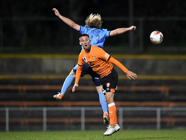 Jordan Courtney-Perkins of Brisbane competes for the ball with Rhyan Grant of Sydney. Picture: AAP Image/Joel Carrett