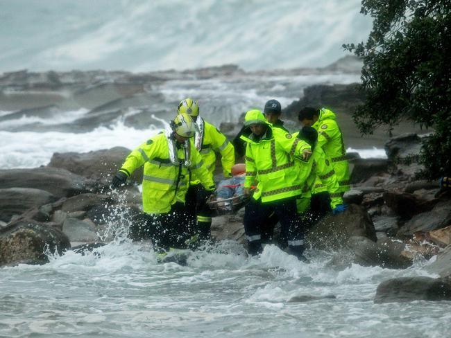 Ambulance crew rescues a man from the rocks at The Haven, Terrigal / Picture: Troy Snook