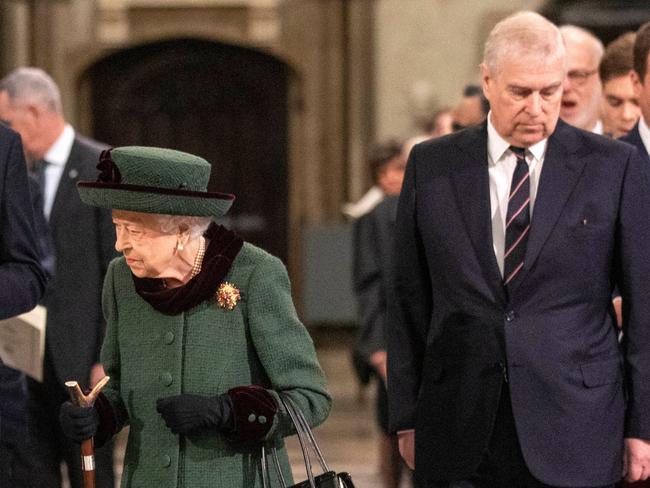 The Queen is escorted to her seat by Prince Andrew. Picture: AFP