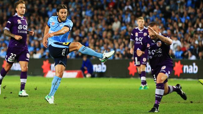 Sydney FC midfielder Josh Brillante scores his long-range opener against Perth Glory on Saturday night.