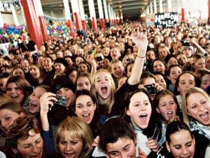 One a fan, always a fan. Crowds pack Westfield Southland in Melbourne for Hanson in 1998.