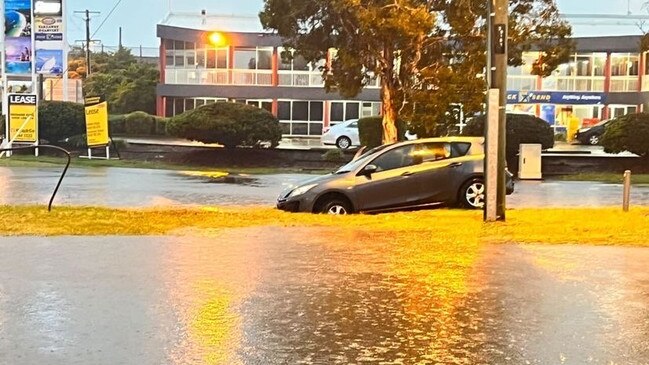 A car found itself in deep water on the corner of Kingsford Smith Dr &amp; Harvey St, Eagle Farm. Picture: Michael Bacon