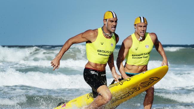 Matt Poole and Matt Bevilacqua racing in the surf together.