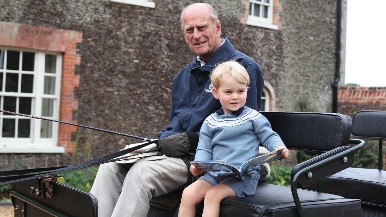 Prince Philip and a young Prince George carriage driving. Picture: The Duchess of Cambridge via Getty Images)