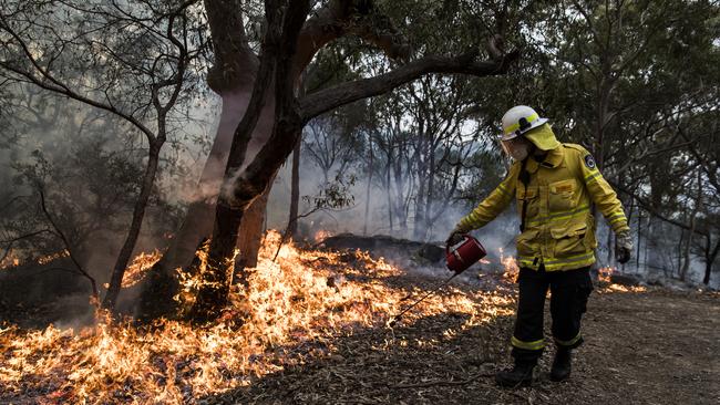 A hazard reduction burn carried out by RFS and National Parks and Wildlife Service crews near homes at Mount Colah. Picture: Dylan Robinson