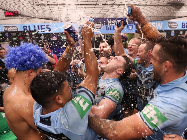 NSW's Angus Crichton and the NSW Blues players celebrate in the rooms after defeating Queensland in Game 2 of the State of Origin series at ANZ Stadium, Sydney. Picture: Brett Costello