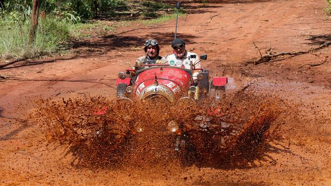 Warren Brown (left) and Matthew Benns with their Bean roadster at Daly Waters in the Northern Territory. Picture: Nigel Wright