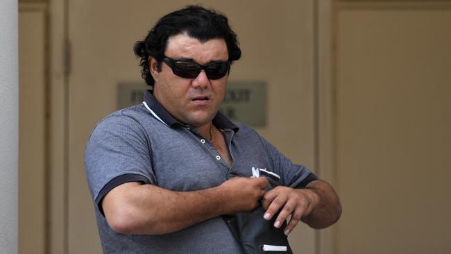 Mihalis Makrylos leaves court on Wednesday after giving testimony