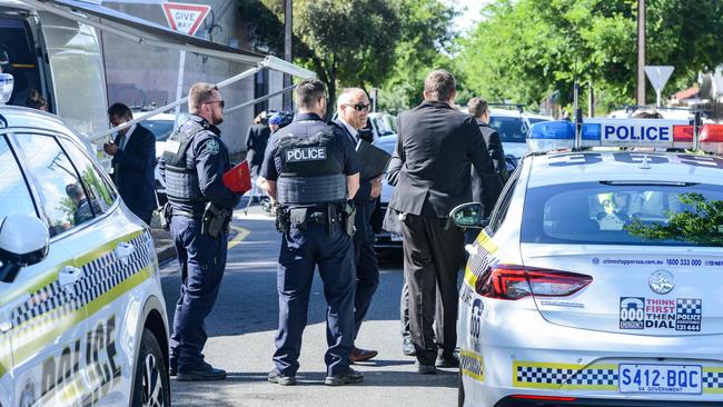 Police confer as they search Dunorlan Road in Edwardstown after the shooting. Picture: NCA NewsWire / Brenton Edwards