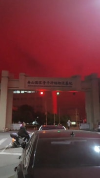 Bizarre scenes as the night sky turns blood red in Chinese town