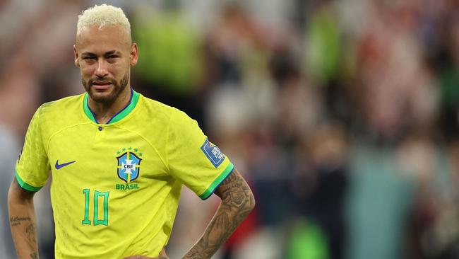 Brazil's #10 Neymar reacts after his team lost to Croatia on penalties. (Photo by Adrian DENNIS / AFP)