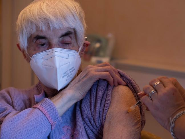 An elderly woman receives a dose of the Pfizer-BioNTech COVID-19 vaccine n Rome. Picture: AFP.