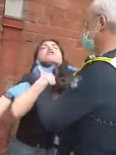 The officer was seen putting his hands on the woman’s throat.