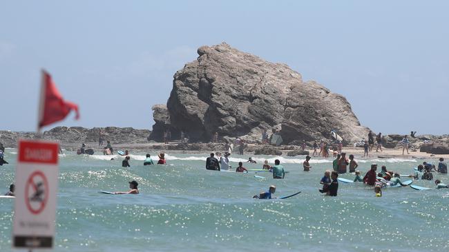 Currumbin Alley busy with swimmers despite the dangers. Picture by Scott Fletcher.