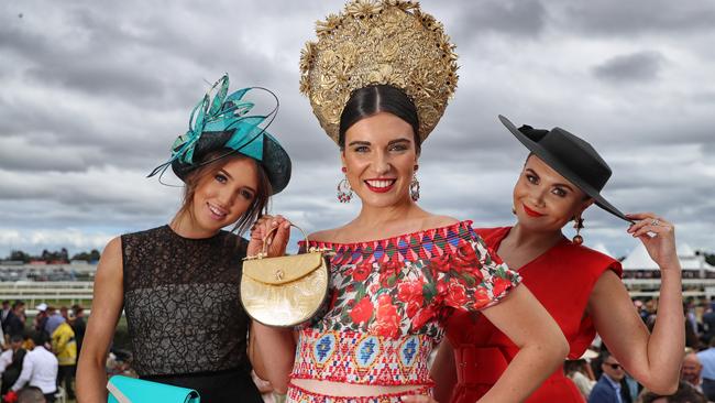 Caulfield Cup glamour and fashion on a wintry day at Caulfield Racecourse. Fashion on The Fields Winners Felicity Northeast, Sally-Anne Mallyon winner of ladies competition, and finalist Natasha Banchtchikov. Picture: Alex Coppel.