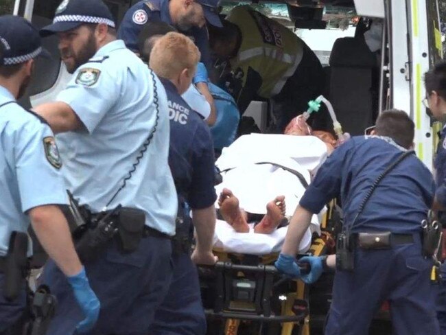 A man is stretchered into an ambulance following the incident. Picture: ABC News