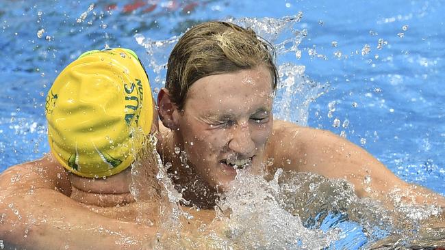 Australia's gold medal winner Mack Horton with his teammate David McKeon celebrating his gold medal in the 400m freestyle.