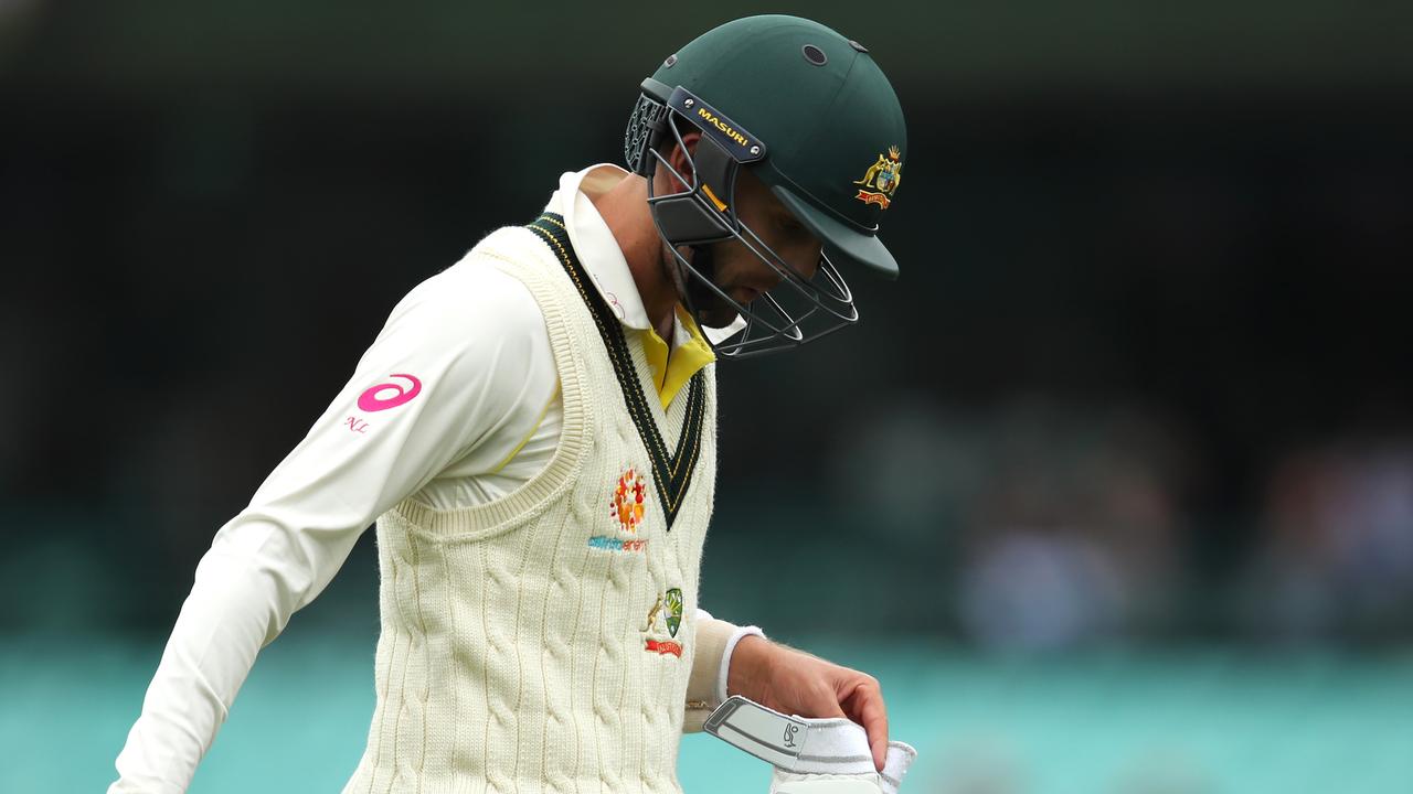 Nathan Lyon of Australia leaves the field after being dismissed by Kuldeep Yadav of India during day four.