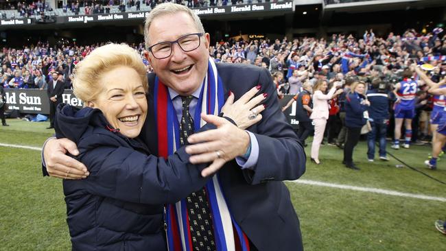 Western Bulldogs vice-president Susan Alberti and former president David Smorgon hug after the 2016 flag win. Picture: David Caird