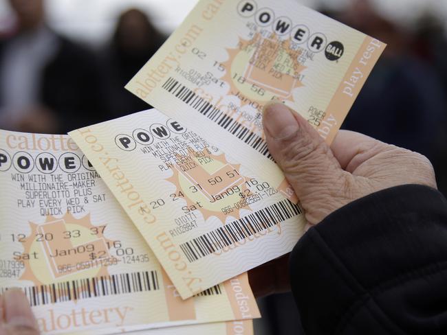 Powerball tickets are shown Saturday, Jan. 9, 2016, in San Lorenzo, Calif. Ticket sales for the multi-state Powerball lottery soared Saturday as people dreamed of winning the largest jackpot in U.S. history, which grew by $100 million to hit $900 million just hours before Saturday night's drawing. (AP Photo/Marcio Jose Sanchez)