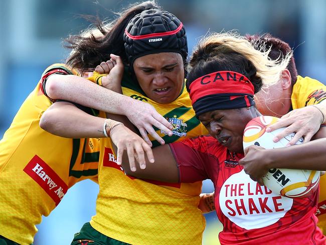 SYDNEY, AUSTRALIA - NOVEMBER 22:  Tiera Reynolds of Canada is tackled during the Women's Rugby League World Cup match between the Canadian Ravens  and the Australian Jillaroos at Southern Cross Group Stadium on November 22, 2017 in Sydney, Australia.  (Photo by Mark Nolan/Getty Images)