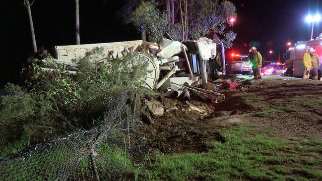 Rescue crews at the scene of a major truck rollover on the Gold Coast overnight. Picture: SEQ News 