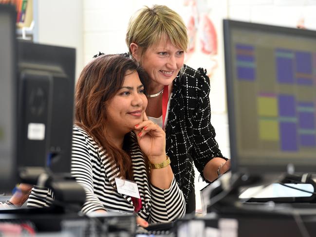 25/08/15 -  Cert III in Health Admin lecturer Lisa Martin teaching a student Remy Murray at TAFE SA Elizabeth Campus.Photo Tom Huntley