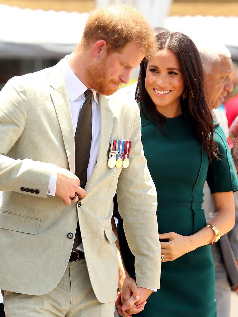 The Duke and Duchess of Sussex Prince Harry and Meghan take part in a traditional fijian ceremony at Nadi Airport in Fiji to . Picture: Nathan Edwards