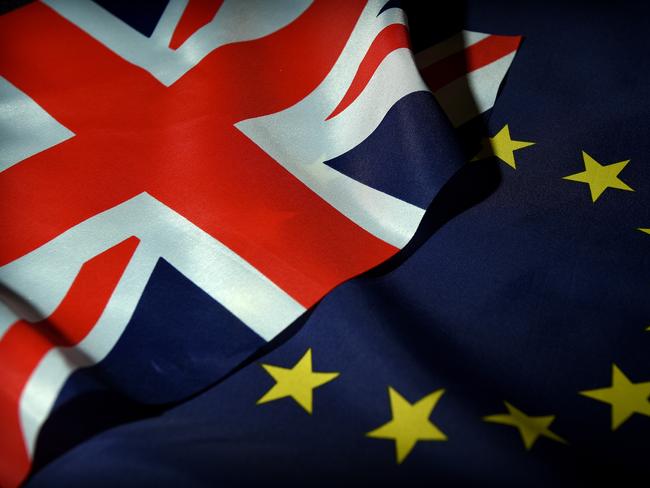 Flags of the United Kingdom and the European Union are seen in Sydney, Thursday, June 16, 2016. Australian Treasurer Scott Morrison has warned against 
