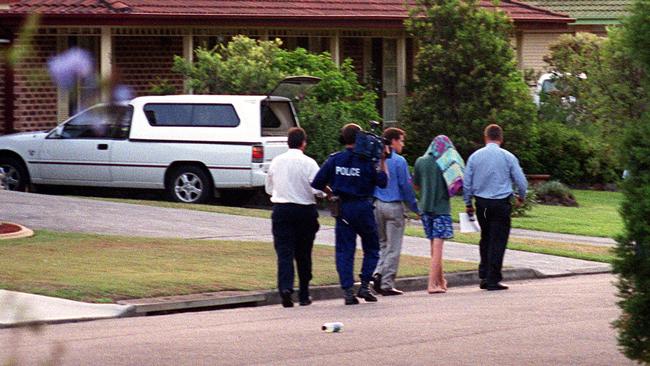 The teenage boy is led away by police after his arrest over abduction and murder of toddler Courtney Morley-Clarke.